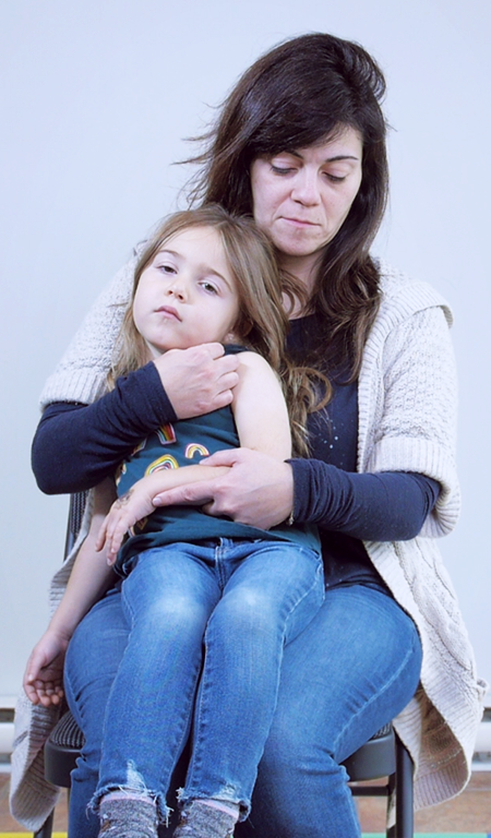 Method 2: Child sitting on your lap with their back against your chest
